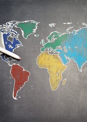 An airplane toy on a drawn world map